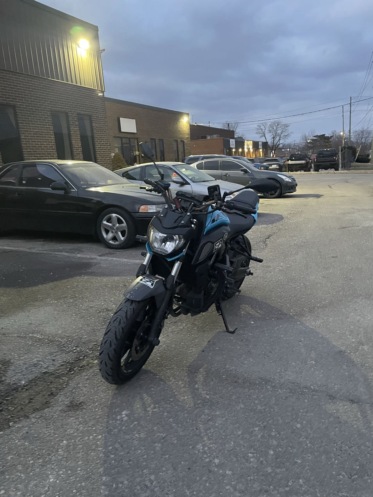 Street motorcycle in lot